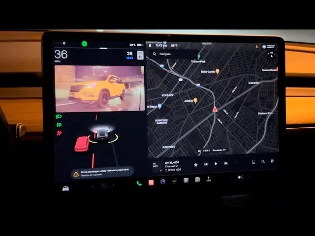 Guide to Tesla’s blind spot camera technology, which enhances safety by providing visual alerts when a vehicle enters the driver's blind spot.