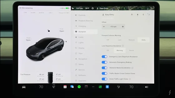 Tesla touchscreen showing Speed Assist settings and options for speed limit warnings.