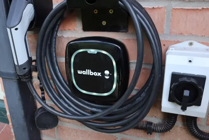 Wallbox Pulsar Plus that is offered in both matte black and white includes a bracket to hold the tethered cable.