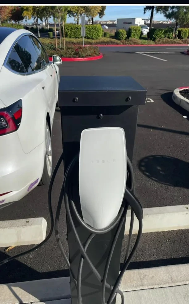 Tesla Destination Charger in a public location, offering a convenient charging option for longer stops.