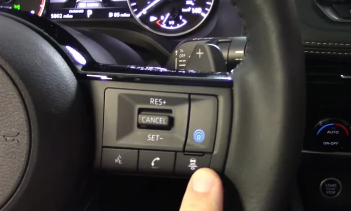 finger press button on steering nissan leaf