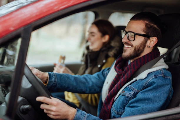 happy young couple travelling with car