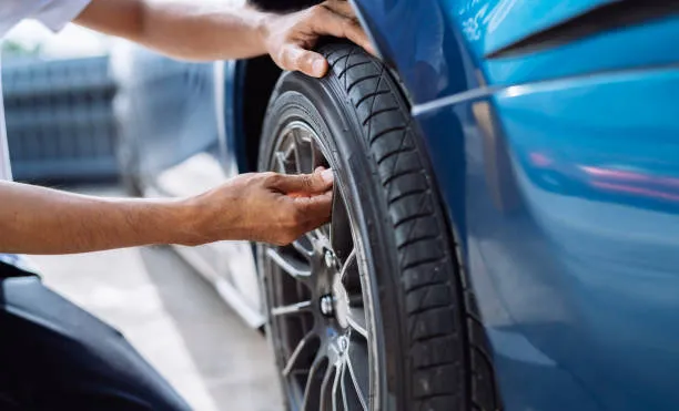 male checking tire valve